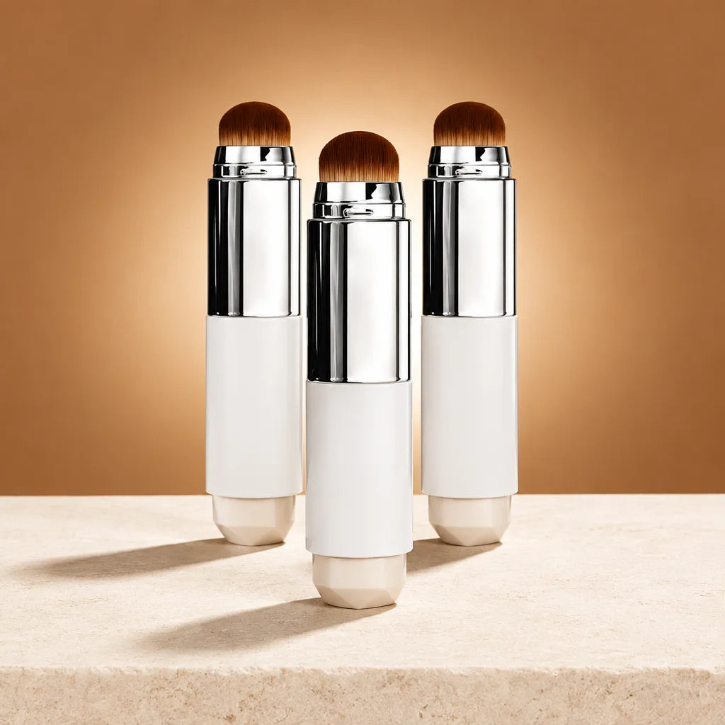 A square studio offer photograph of exactly three complete identical Luméa 2-in-1 foundation sticks,
